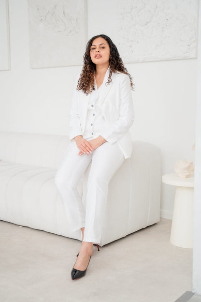 White satin 3-piece pantsuit from EDKAY COLLECTION UK featuring a tailored blazer, matching pants, and a stylish top.